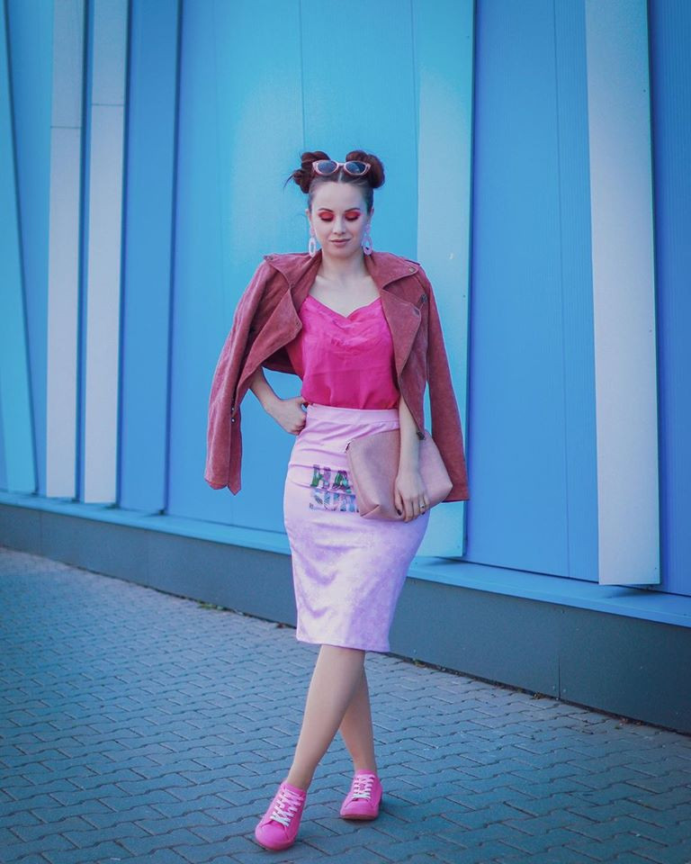 the woman is wearing a pink dress-cowcow