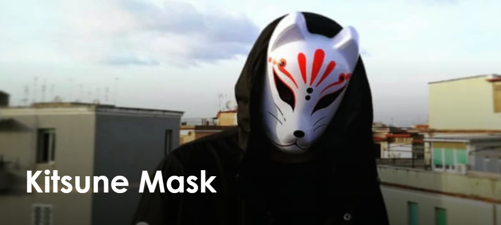 Japanese Kitsune Mask A person wearing a kitsune mask in black japanese clothes