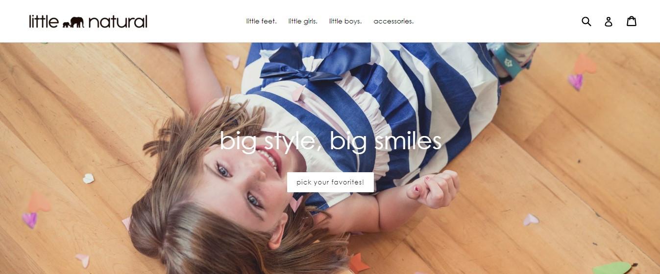 Little Natural website Little Natural baby girl is lying and smiling