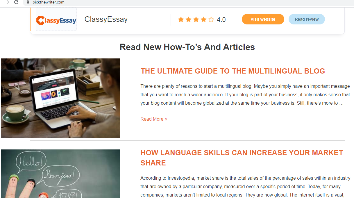 a man is using his computer with a cup of coffee beside